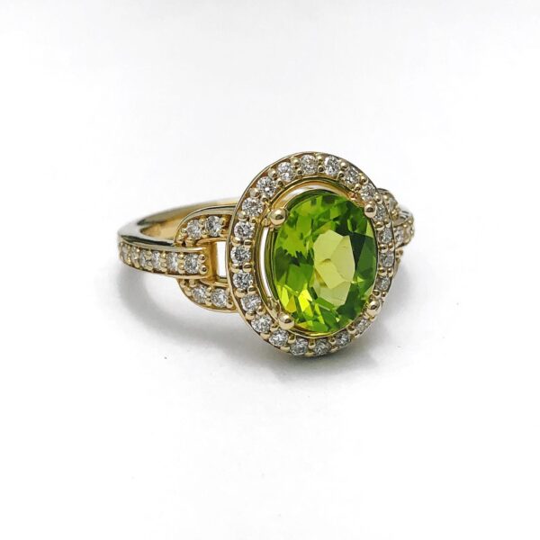 14kt yellow gold 1.72ct oval peridot & diamond halo .41ctw ring