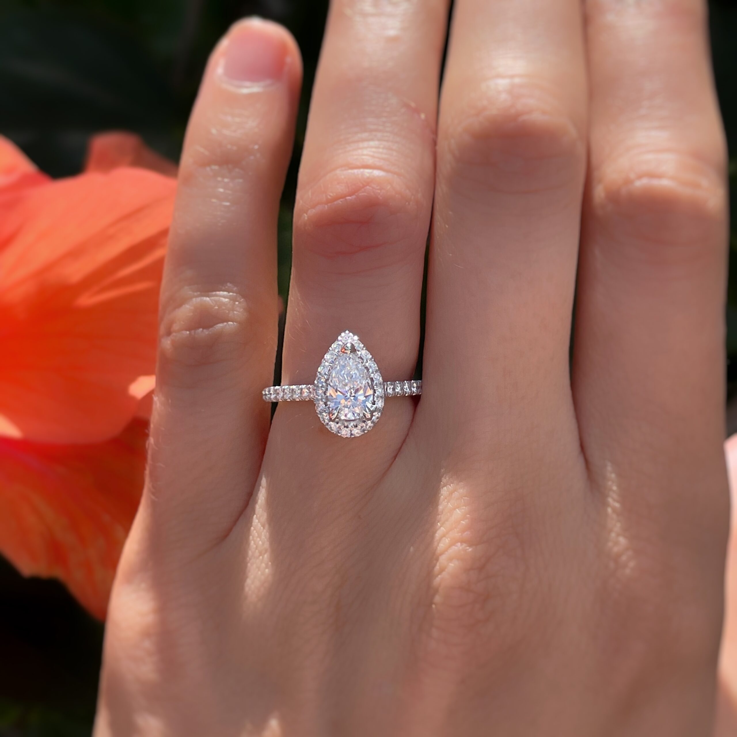 A 4.04 ct yellow pear shaped diamond and 3.02 ct colorless pear shaped  diamond in a bypass engagement ring setting. - GIA 4Cs