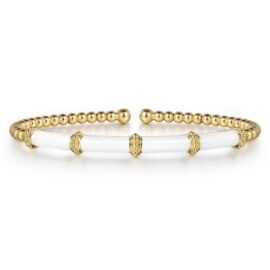 gold beads and white enamel bangle